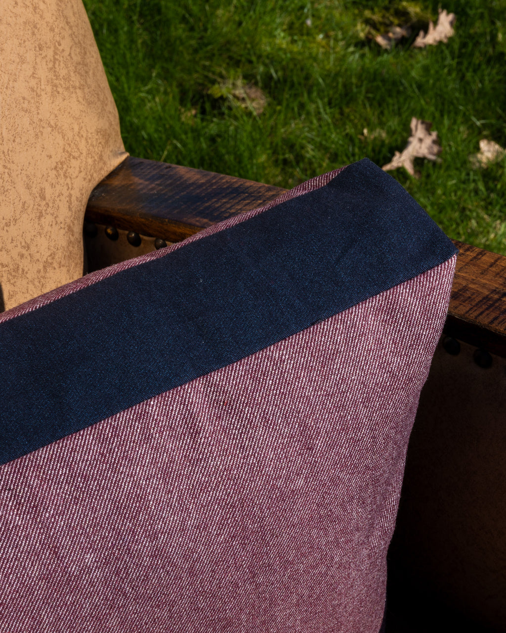 Pillow made from designer fabrics, deadstock fabrics, vintage fabrics, antique fabrics. A second hand wool serge fabric and a dark denim fabric border.